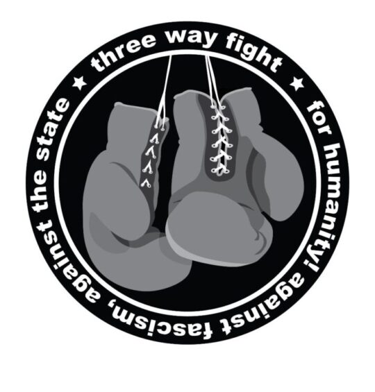 Outer circle that says Three Way Fight, for humanity! against fascism, against the state. Inner circle has two hanging boxing gloves.